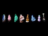 Eight Chinese Precious Stone and Lacquered Snuff Bottles
