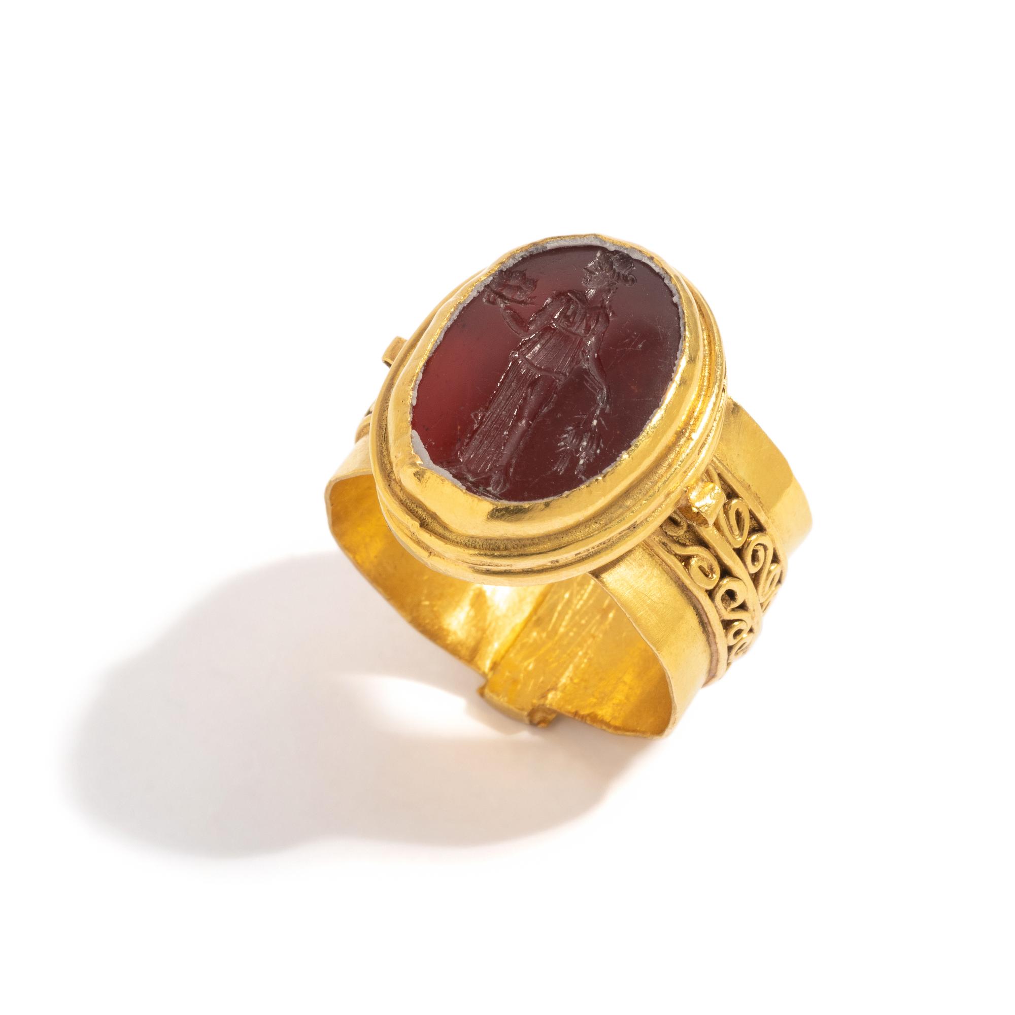 A Roman Carnelian Ring Stone with the Goddess Ceres — Set in a gold ring