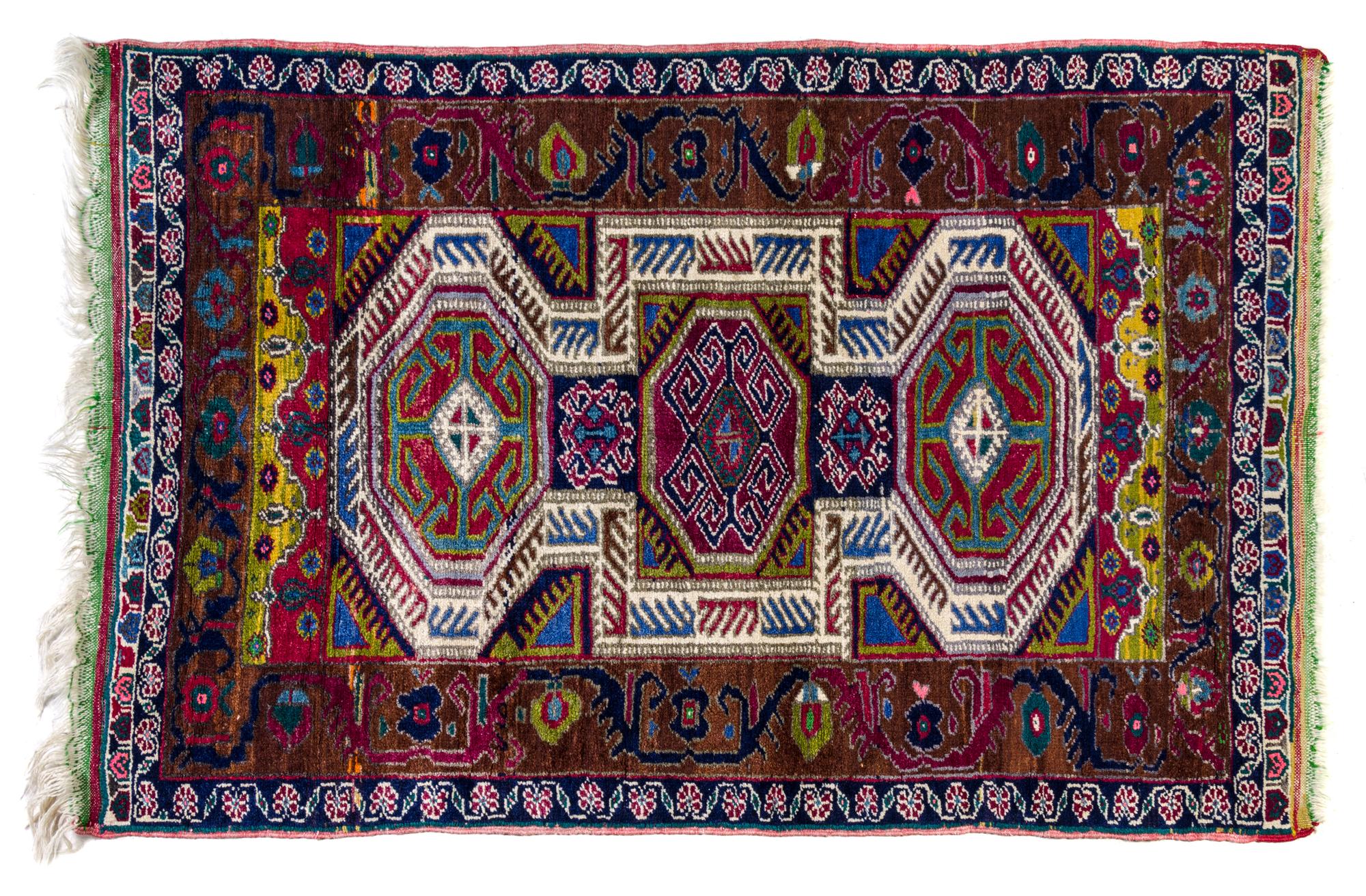 A Caucasian Wool Rug 4 feet 5 inches x 3 feet.