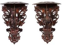 A Pair of Carved Oak Figural Wall Brackets