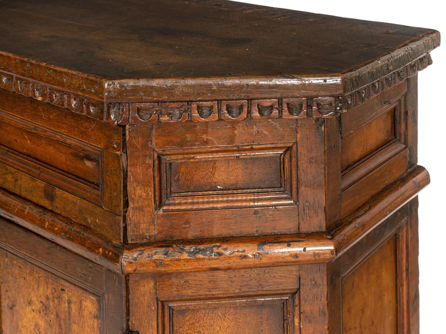 An Italian Baroque Carved Walnut Cabinet