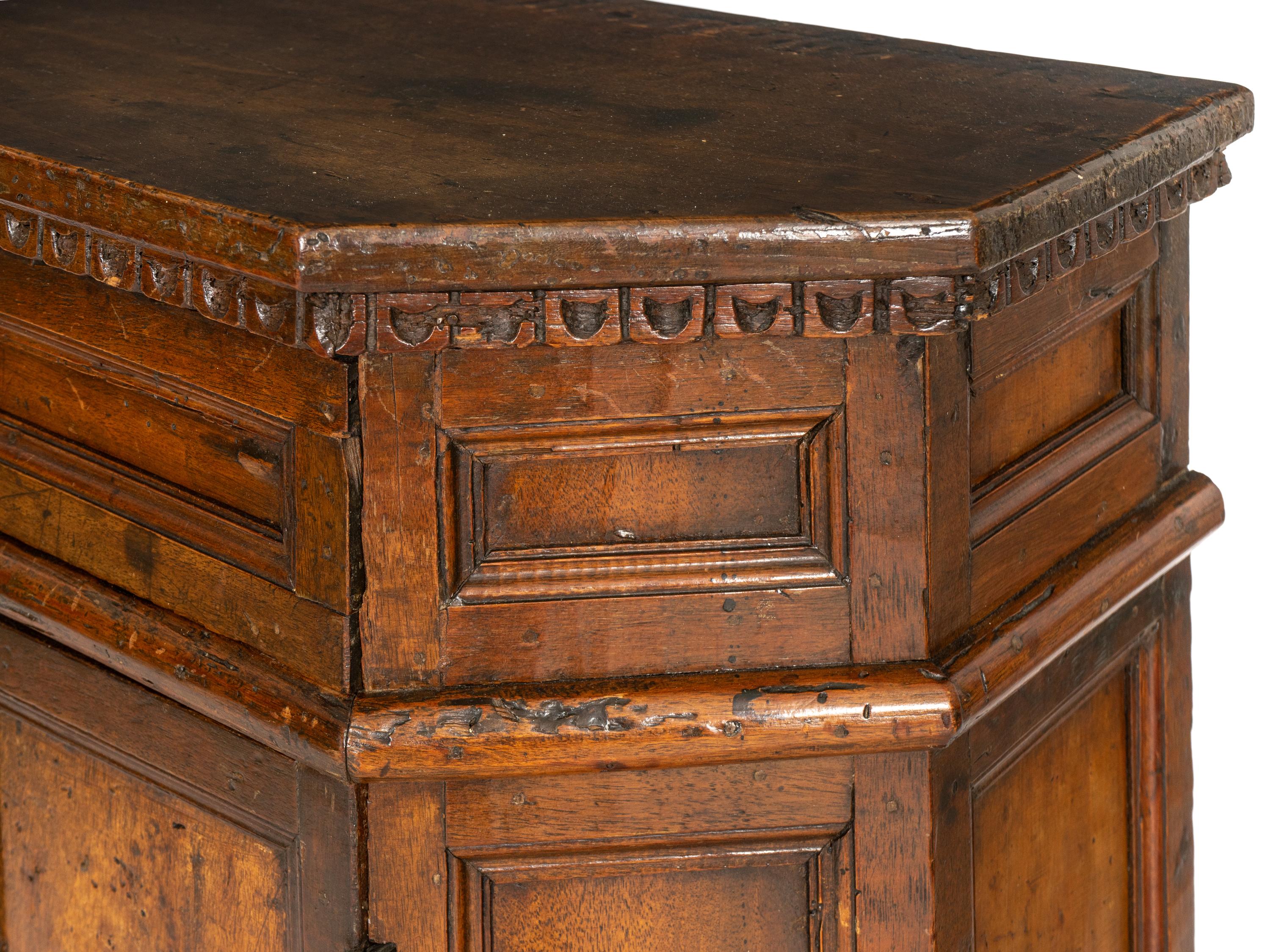 An Italian Baroque Carved Walnut Cabinet