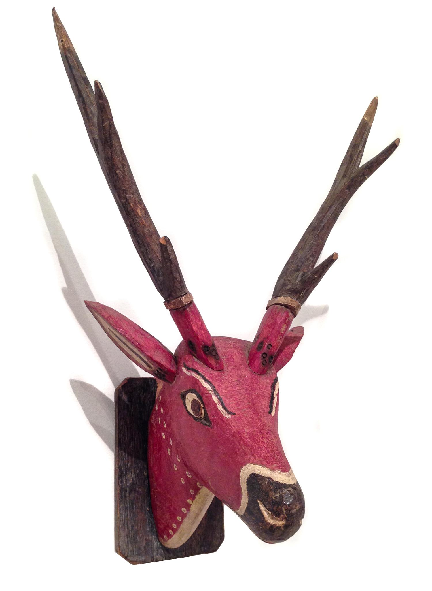 A Pair of Carved and Painted Deer Head Wall Mounts Height of taller 35 inches.