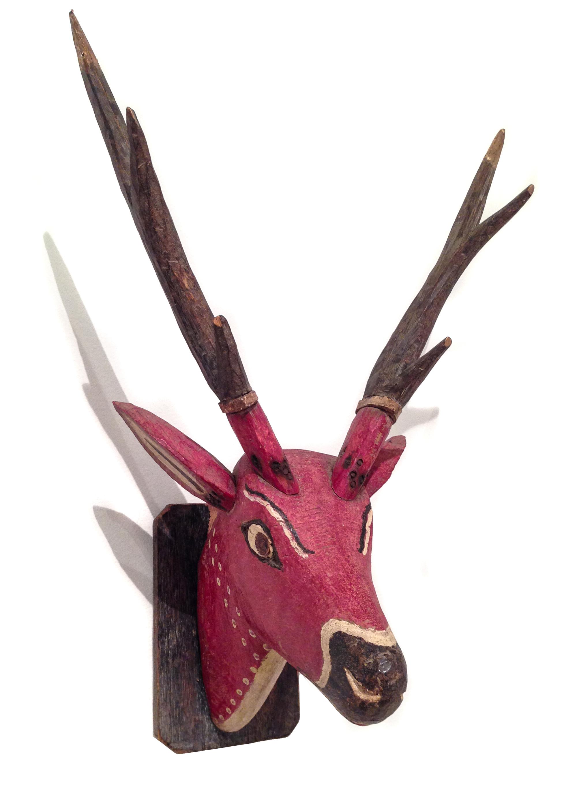 A Pair of Carved and Painted Deer Head Wall Mounts Height of taller 35 inches.