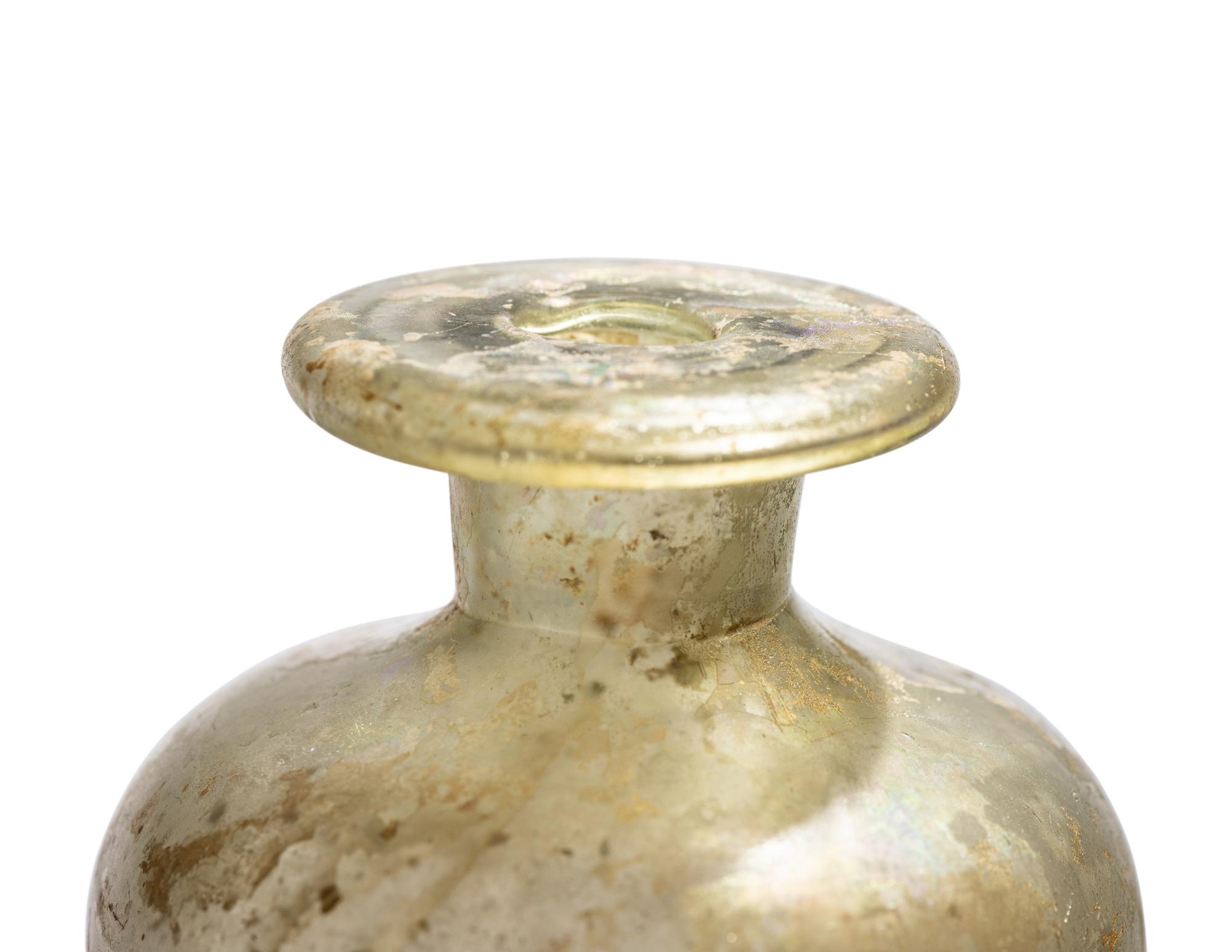 A Roman Pale Blue Glass Bottle