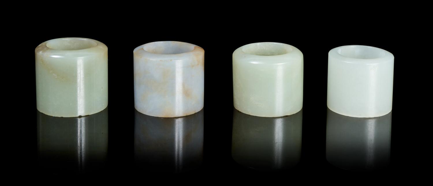 Four Jade Archer's Rings Diameter overall of largest 1 1/8 inches.