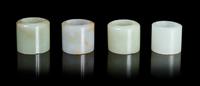 Four Jade Archer's Rings Diameter overall of largest 1 1/8 inches.
