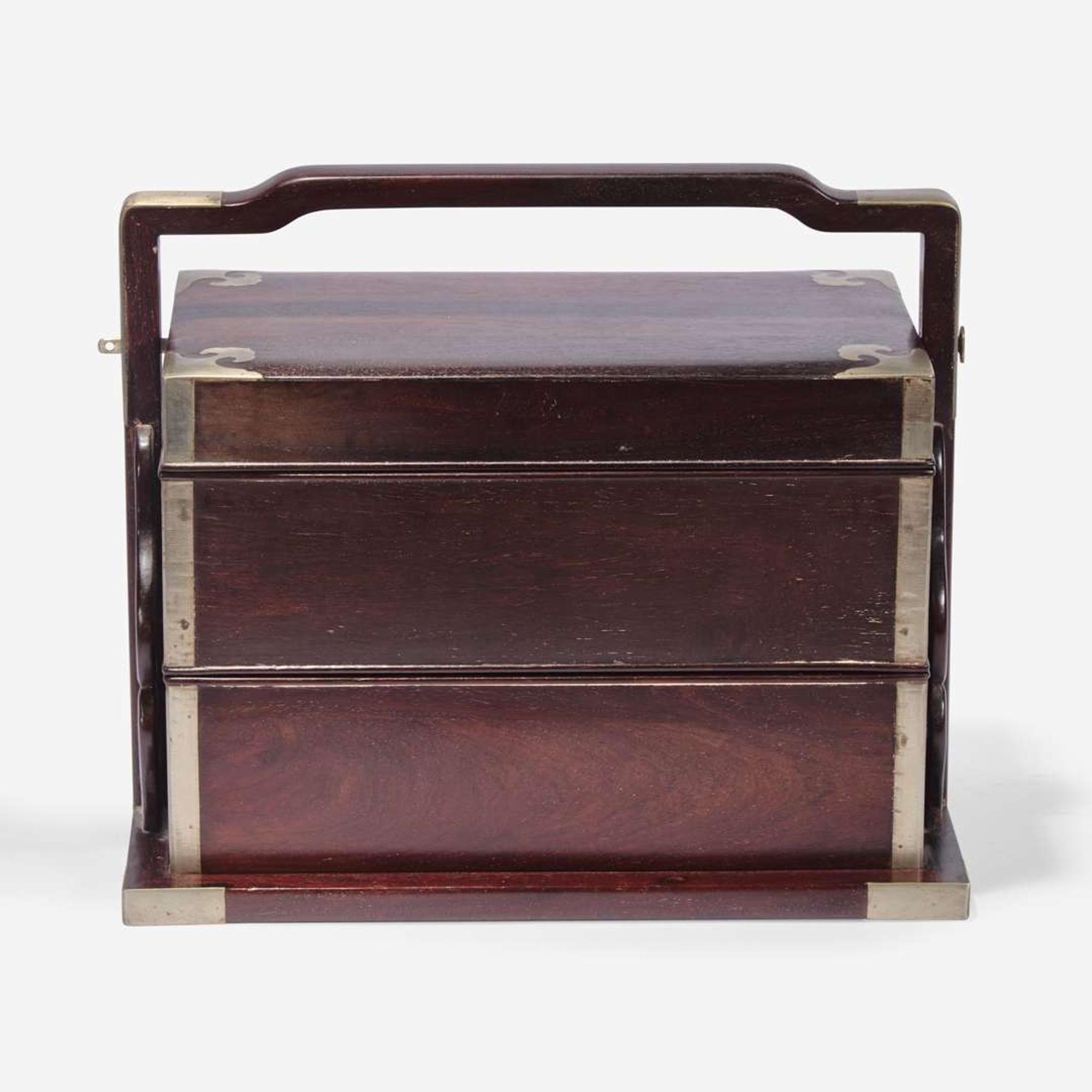 A Chinese stacking hardwood two-tier box, possibly zitan 双层提梁木盒 或紫檀