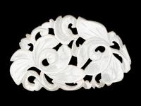 Three Chinese Pale Celadon Jade Reticulated Flori-Form Pendants
