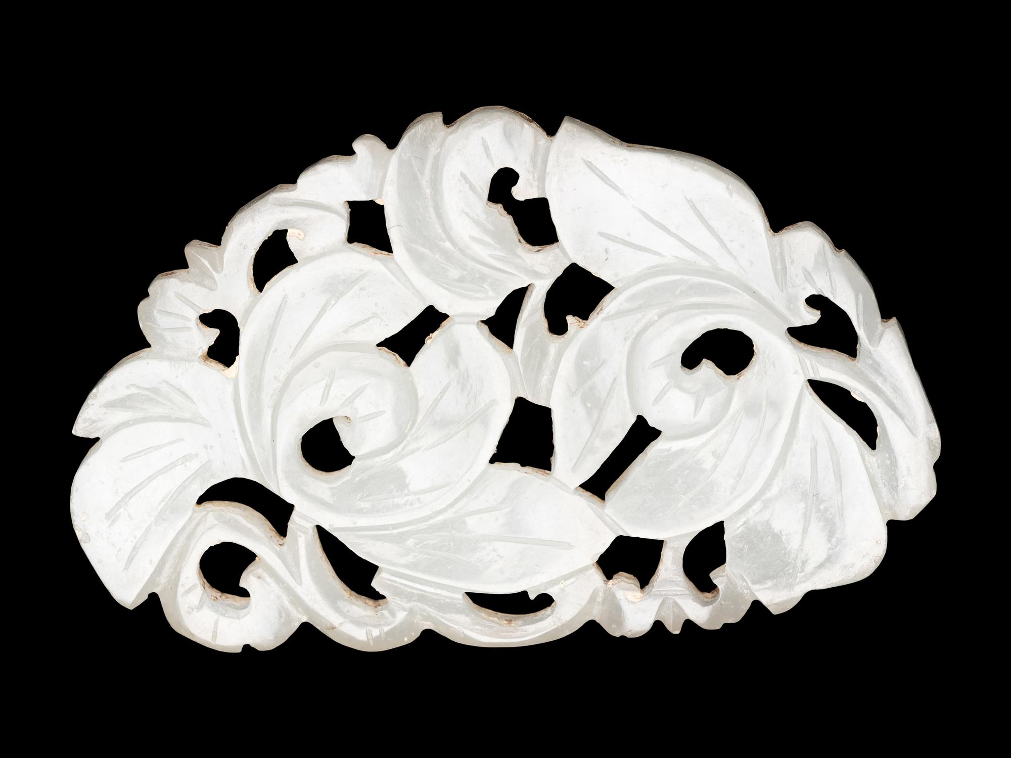 Three Chinese Pale Celadon Jade Reticulated Flori-Form Pendants