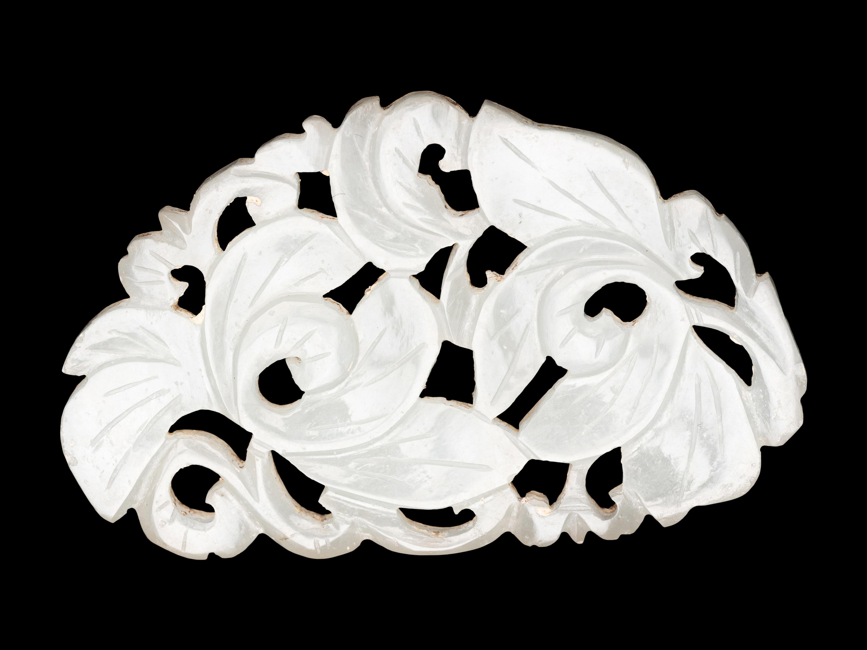 Three Chinese Pale Celadon Jade Reticulated Flori-Form Pendants