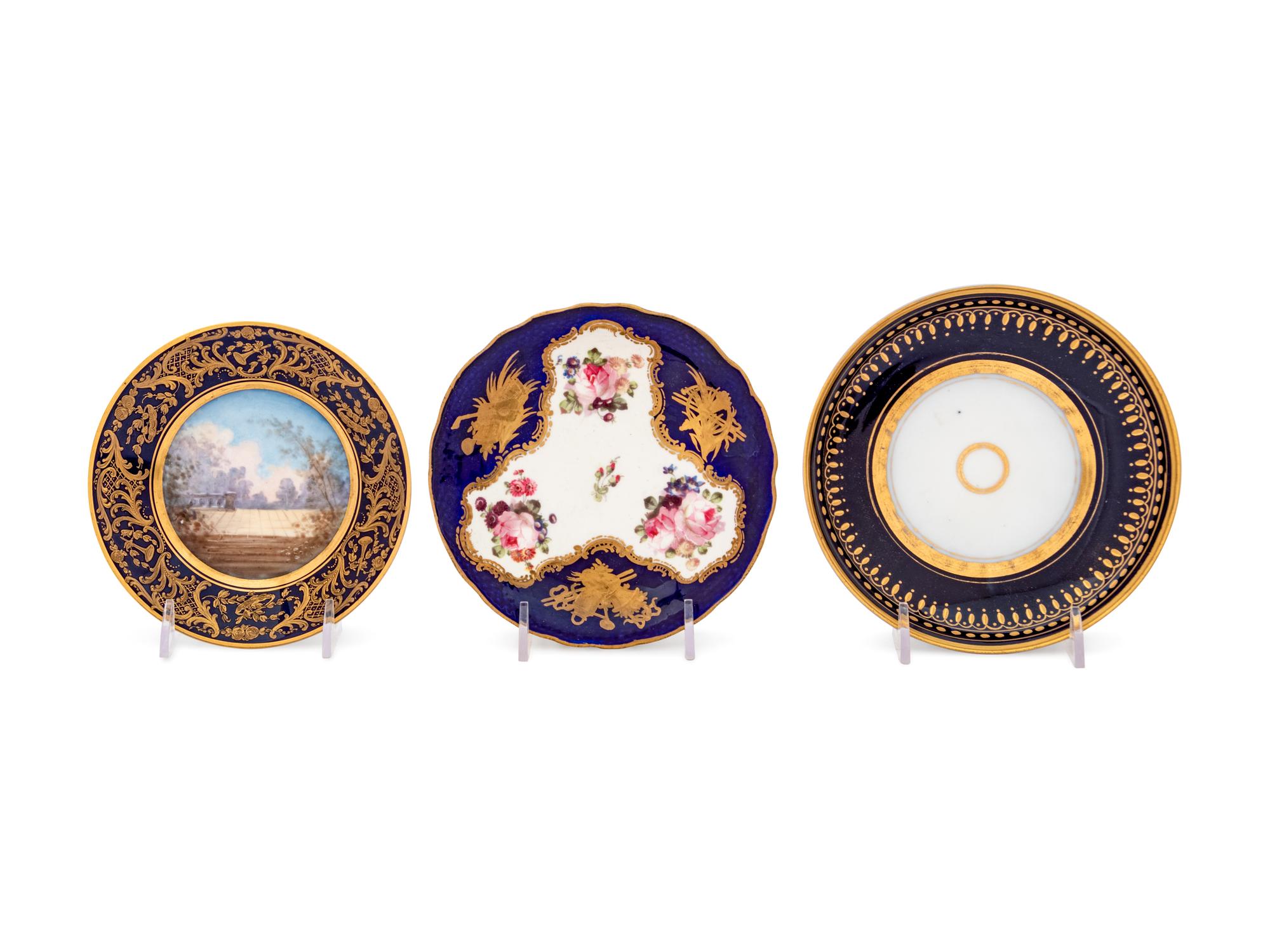 An Assembled Set of Six Sèvres Style Painted and Parcel Gilt Porcelain Teacups and Saucers