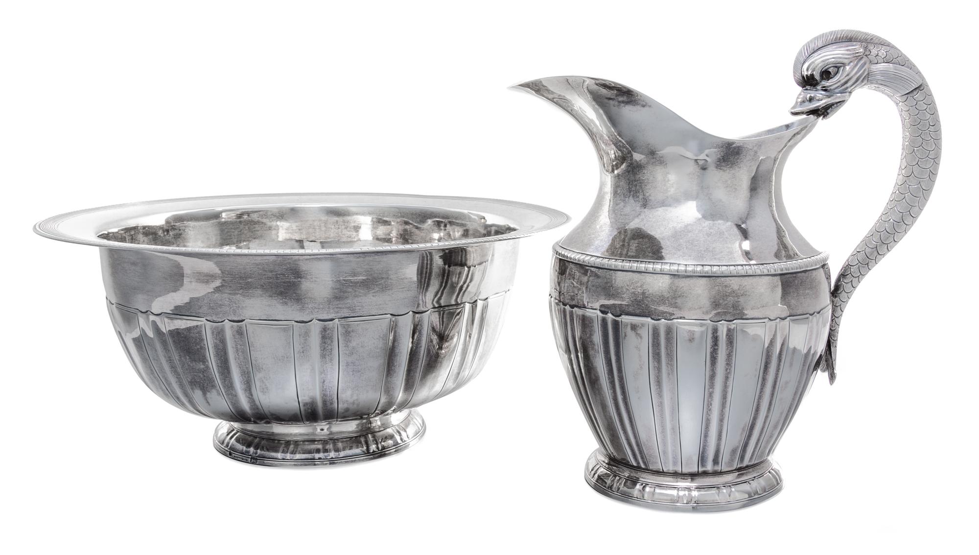 A Portuguese Silver Ewer and Basin, Maria da Gloria, Porto, Circa 1853, the ewer with a dolphin handle, the bowl with a ribbed edge.