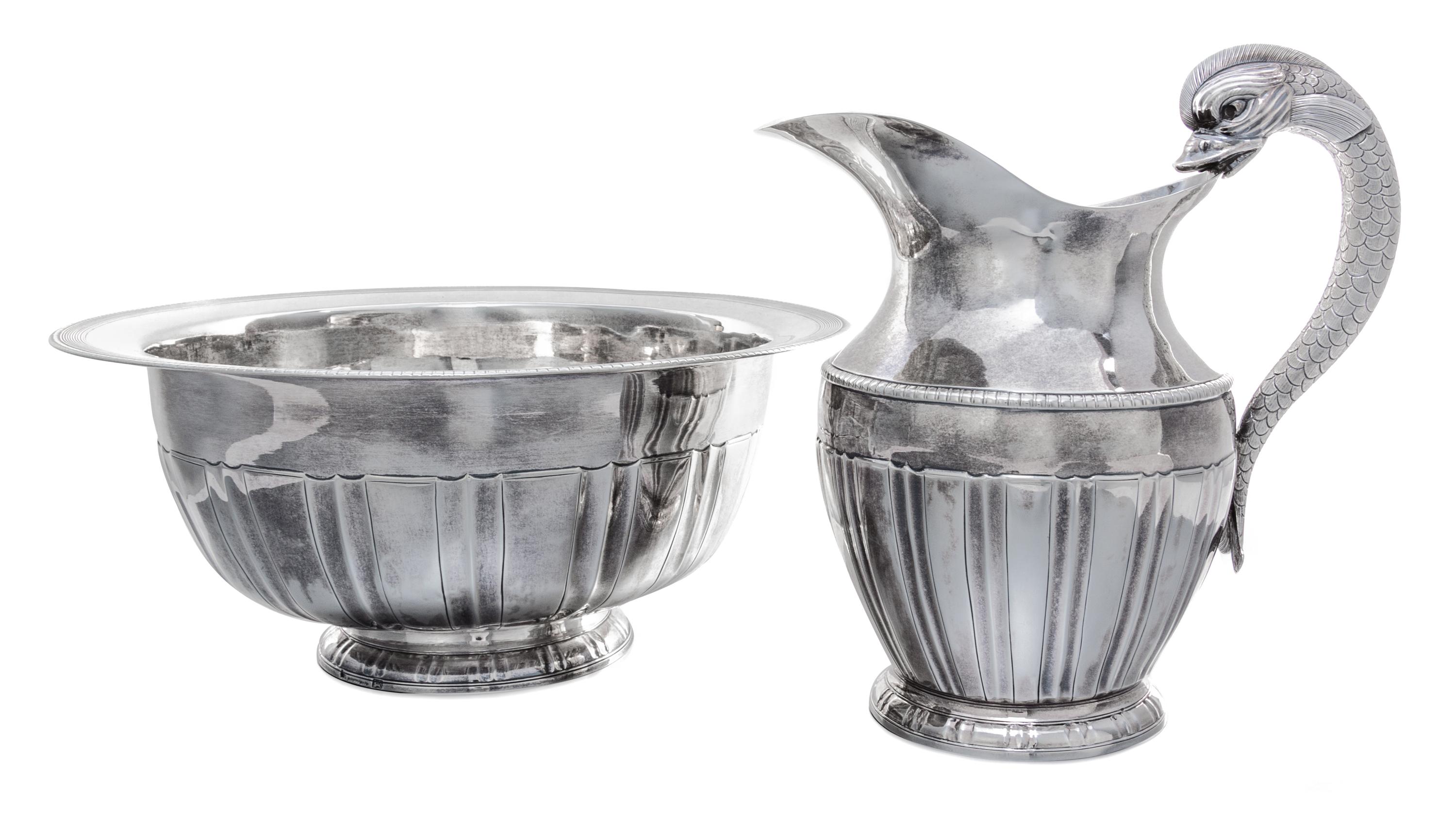 A Portuguese Silver Ewer and Basin, Maria da Gloria, Porto, Circa 1853, the ewer with a dolphin handle, the bowl with a ribbed edge.