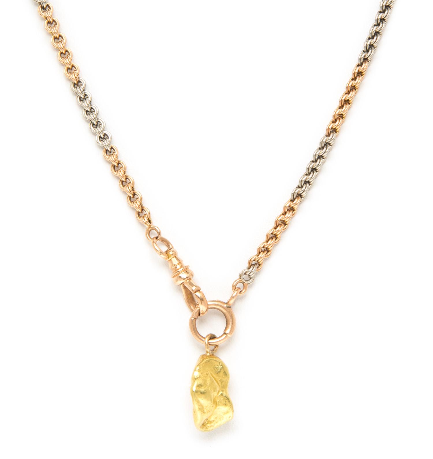 A 14 Karat Gold Fob Chain with an Attached Gold Nugget Charm, 21.30 dwts.