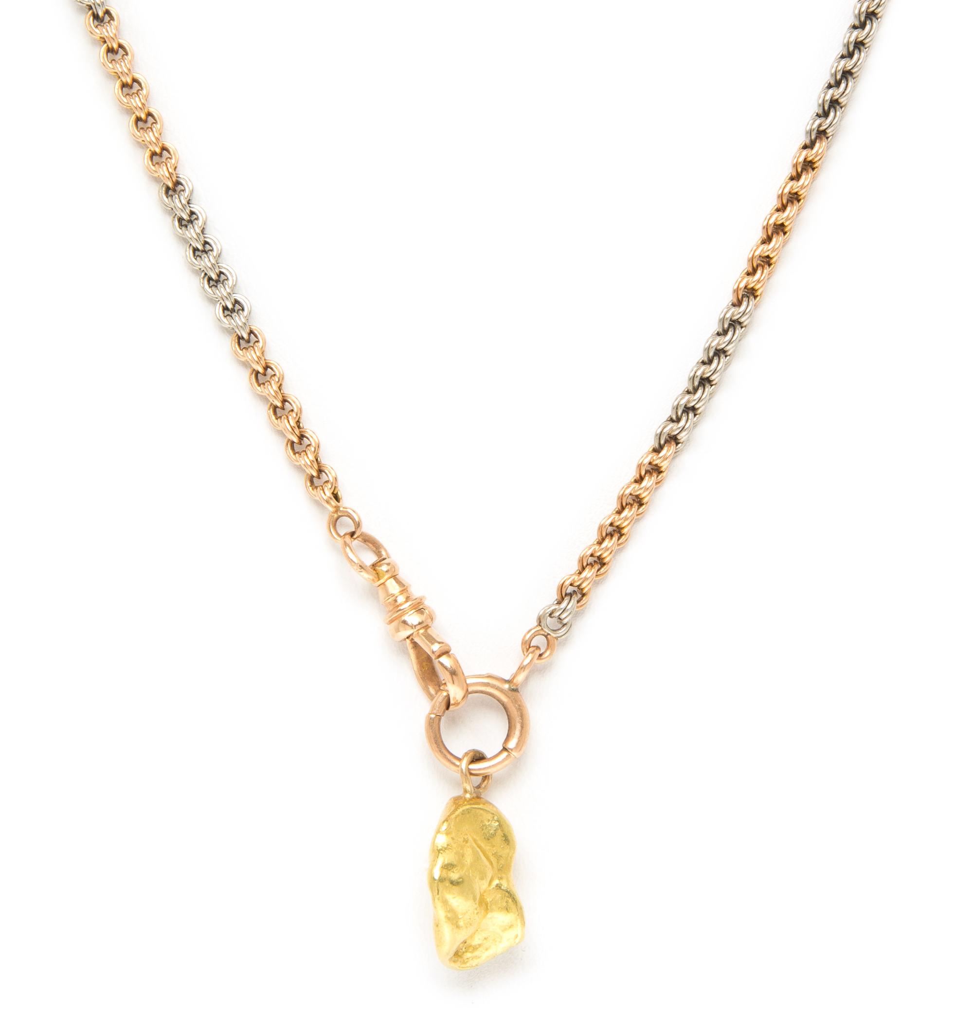 A 14 Karat Gold Fob Chain with an Attached Gold Nugget Charm, 21.30 dwts.