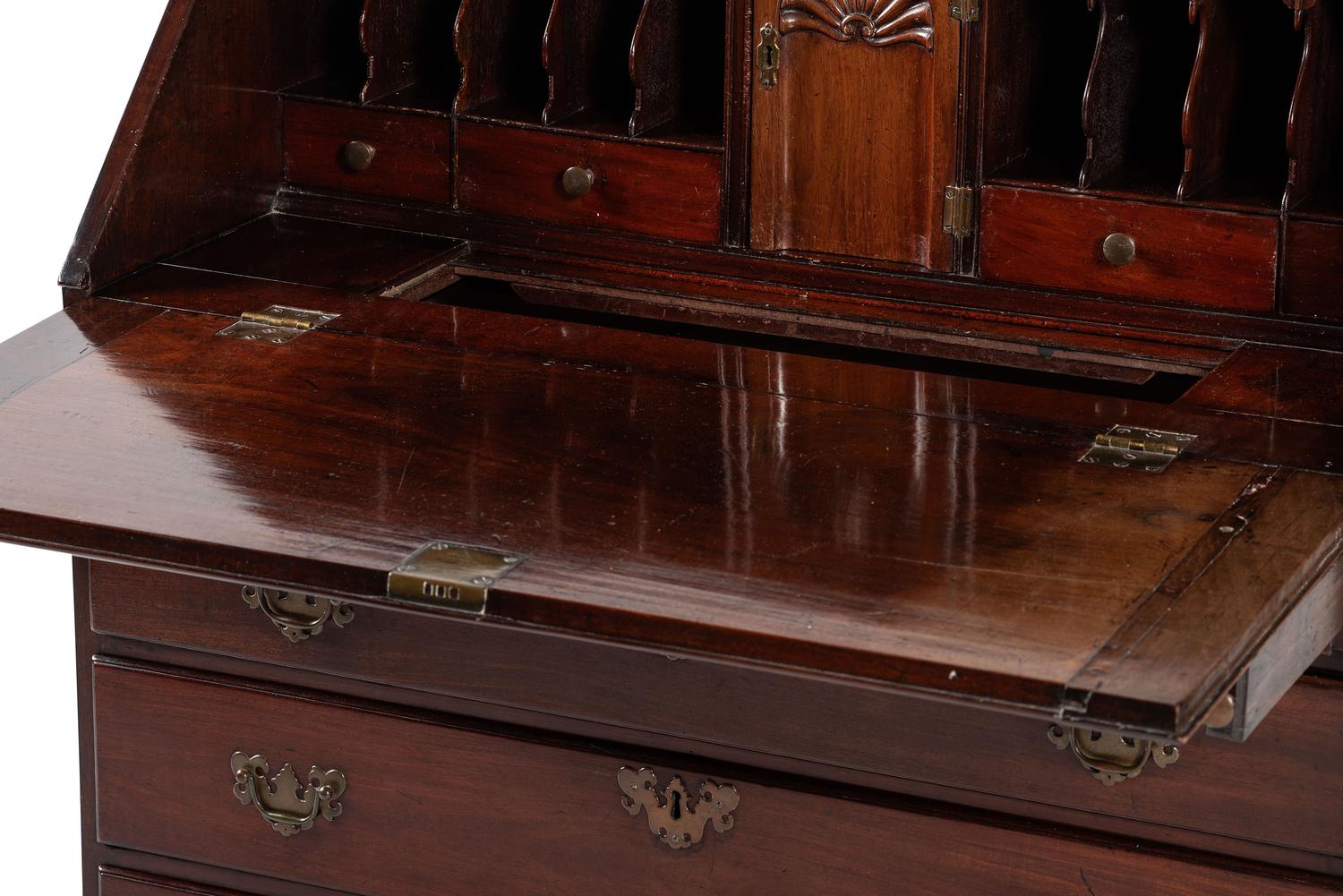 A Chippendale Figured and Shell-Carved Mahogany Slant Front Desk