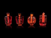 Four Chinese Amber Tone Glass Snuff Bottles