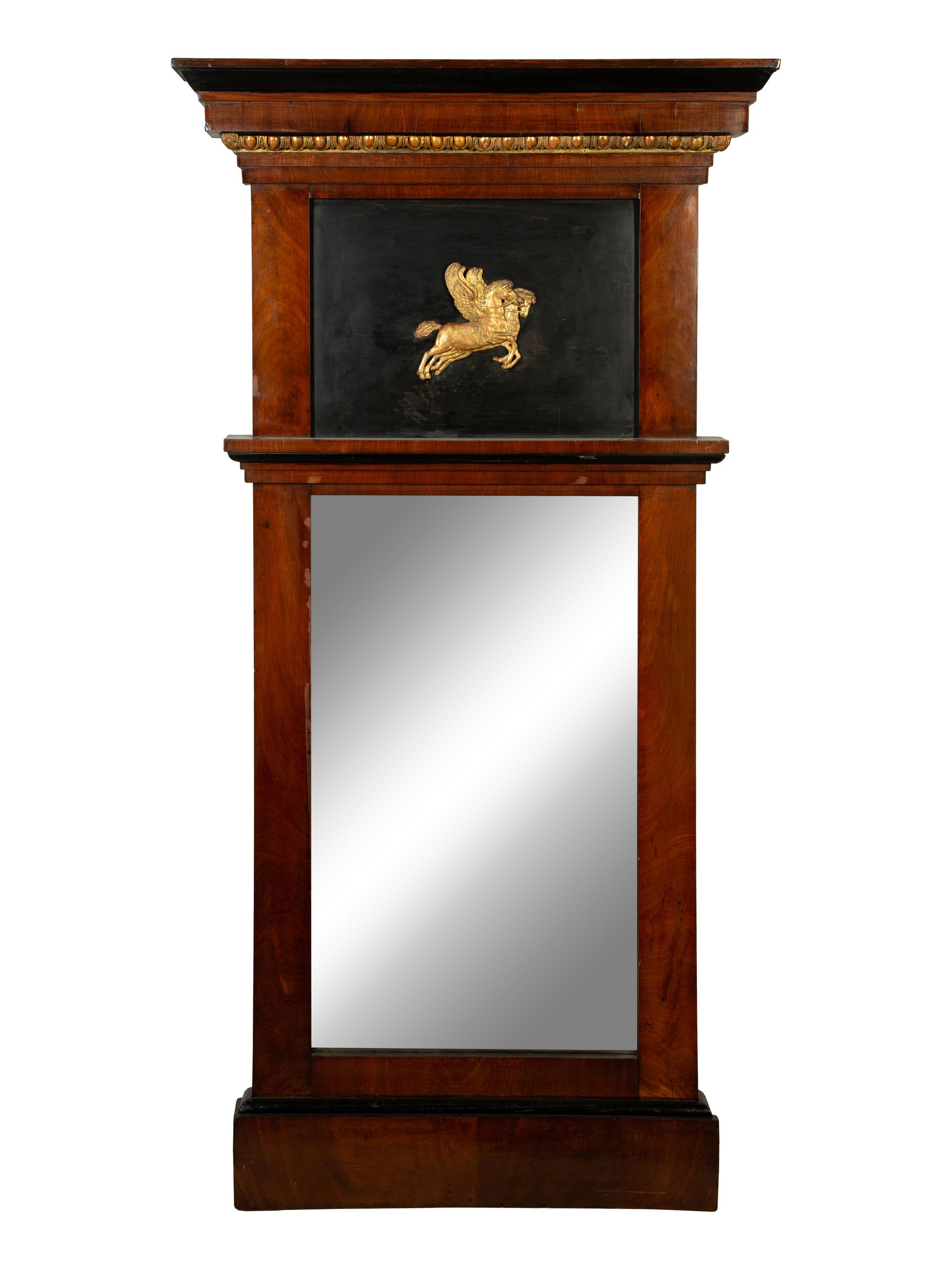 An Austrian Neoclassical Parcel Gilt and Ebonized Walnut Mirror