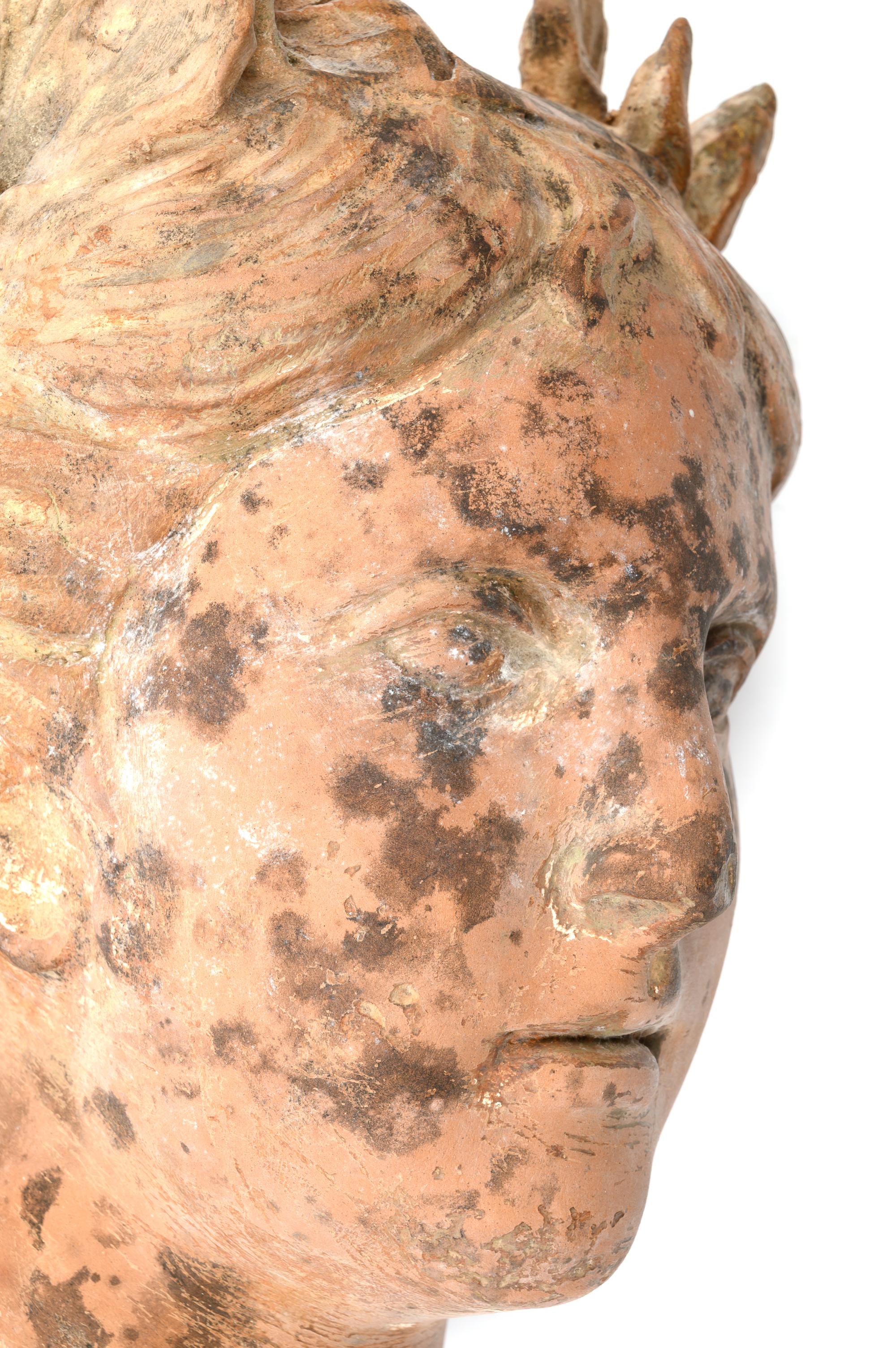 A Roman Style Terracotta Head of a Woman