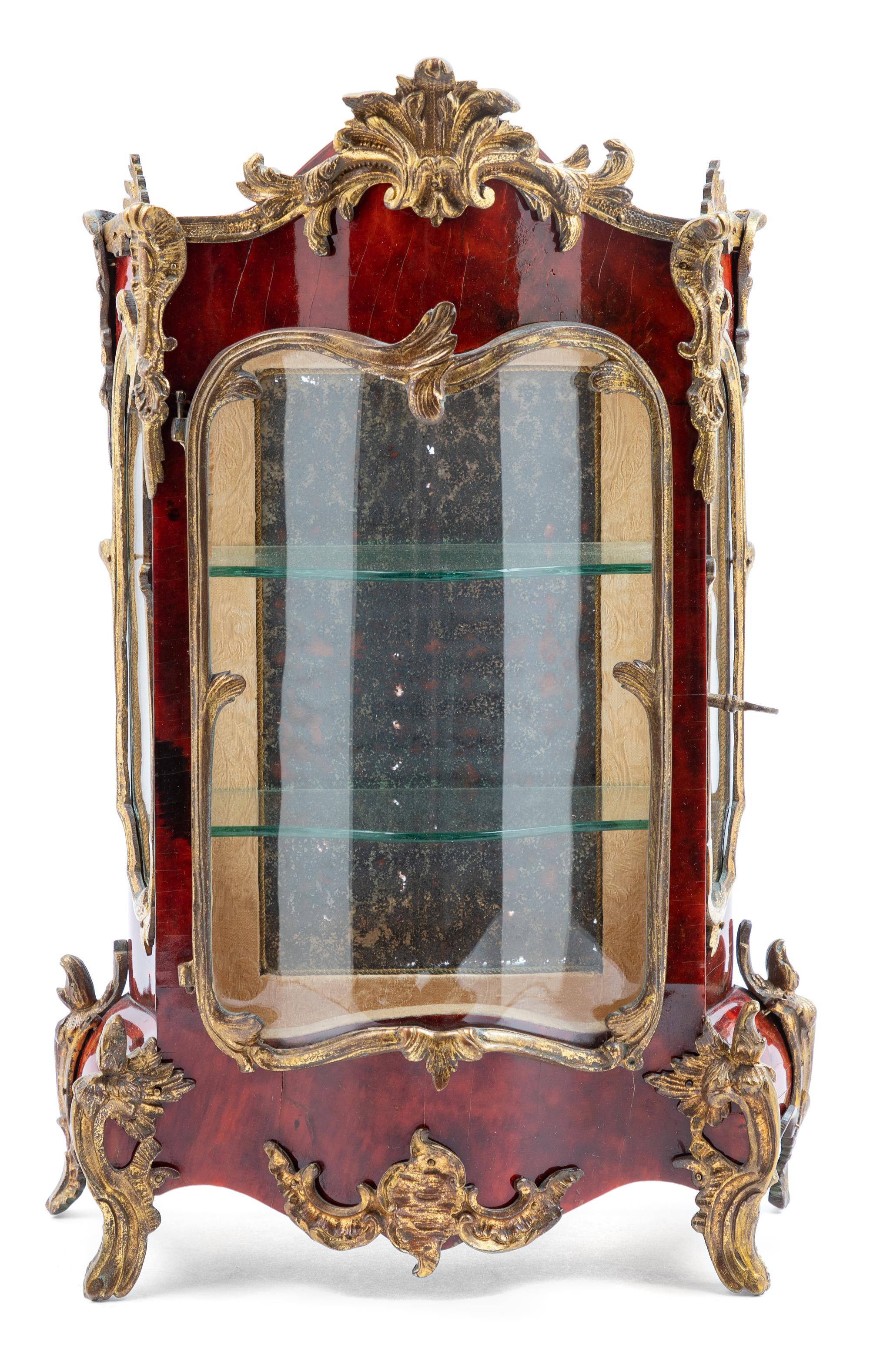 A Diminutive French Gilt Metal Mounted Tortoise Shell Vitrine Cabinet Height 14 inches. — 19TH CENTURY