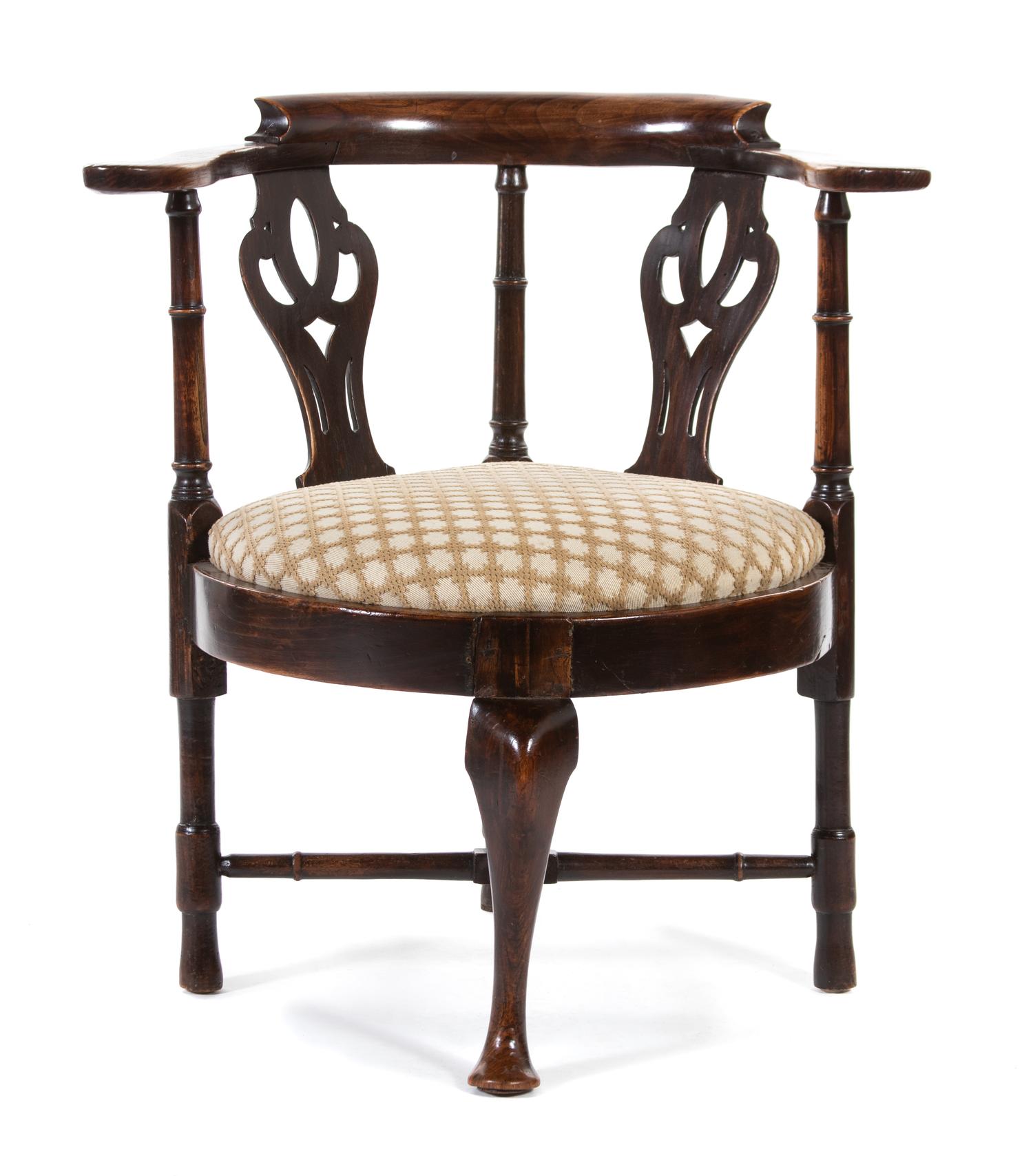 A George III Provincial Elmwood and Mahogany Corner Armchair