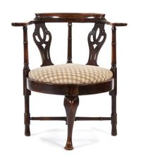 A George III Provincial Elmwood and Mahogany Corner Armchair