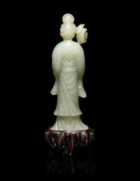 A Chinese Carved Pale Celadon Jade Standing Female Figure
