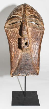 A Songe Wood and Metal Mask. Height 15 inches.