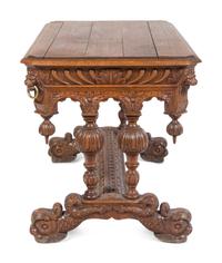 A Renaissance Revival Carved Oak Library Table in the Style of R.J. Horner