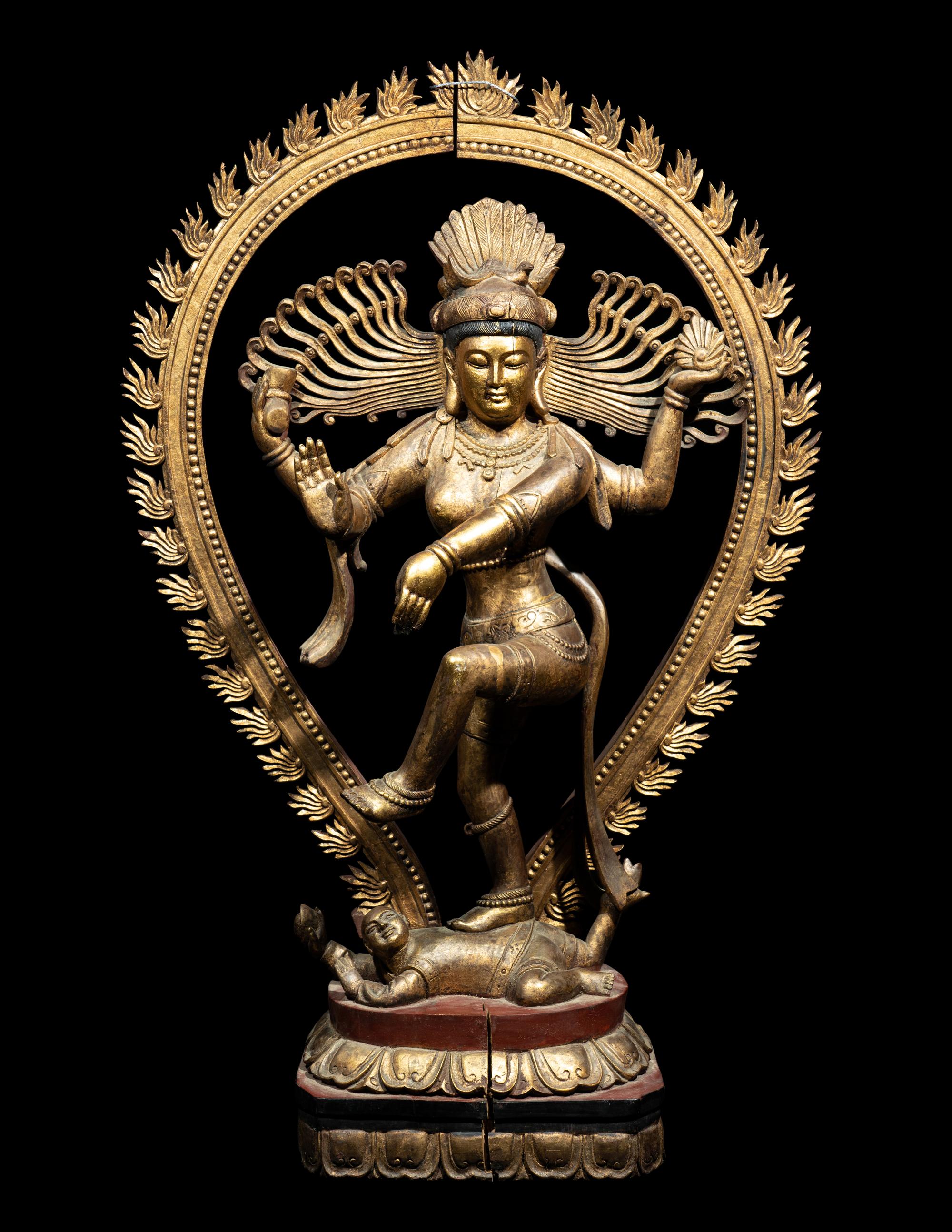 A Large Gilt and Red Lacquered Wood Figure of a Dancing Deity