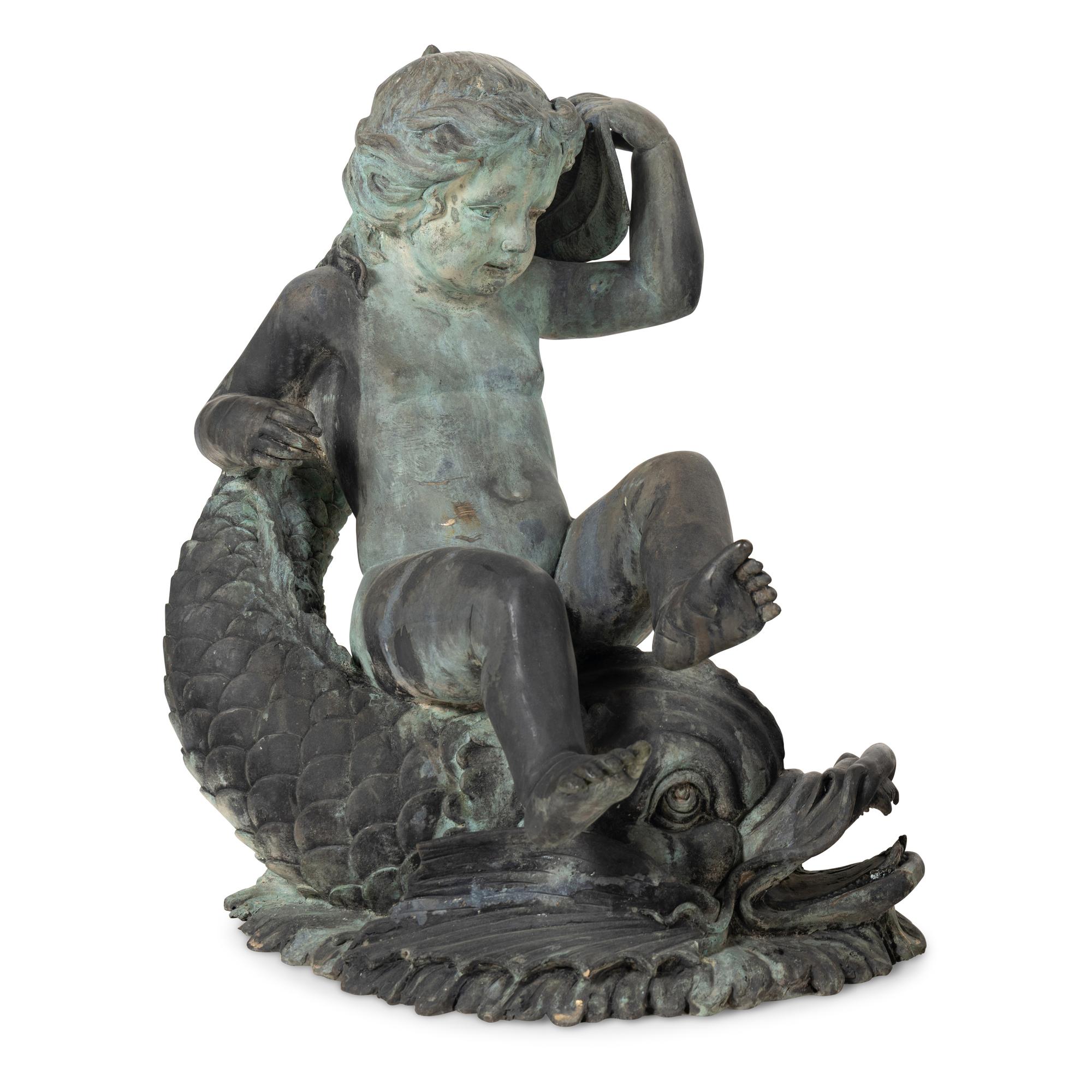 A Patinated Bronze Fountain Figure of a Youth Atop a Dolphin