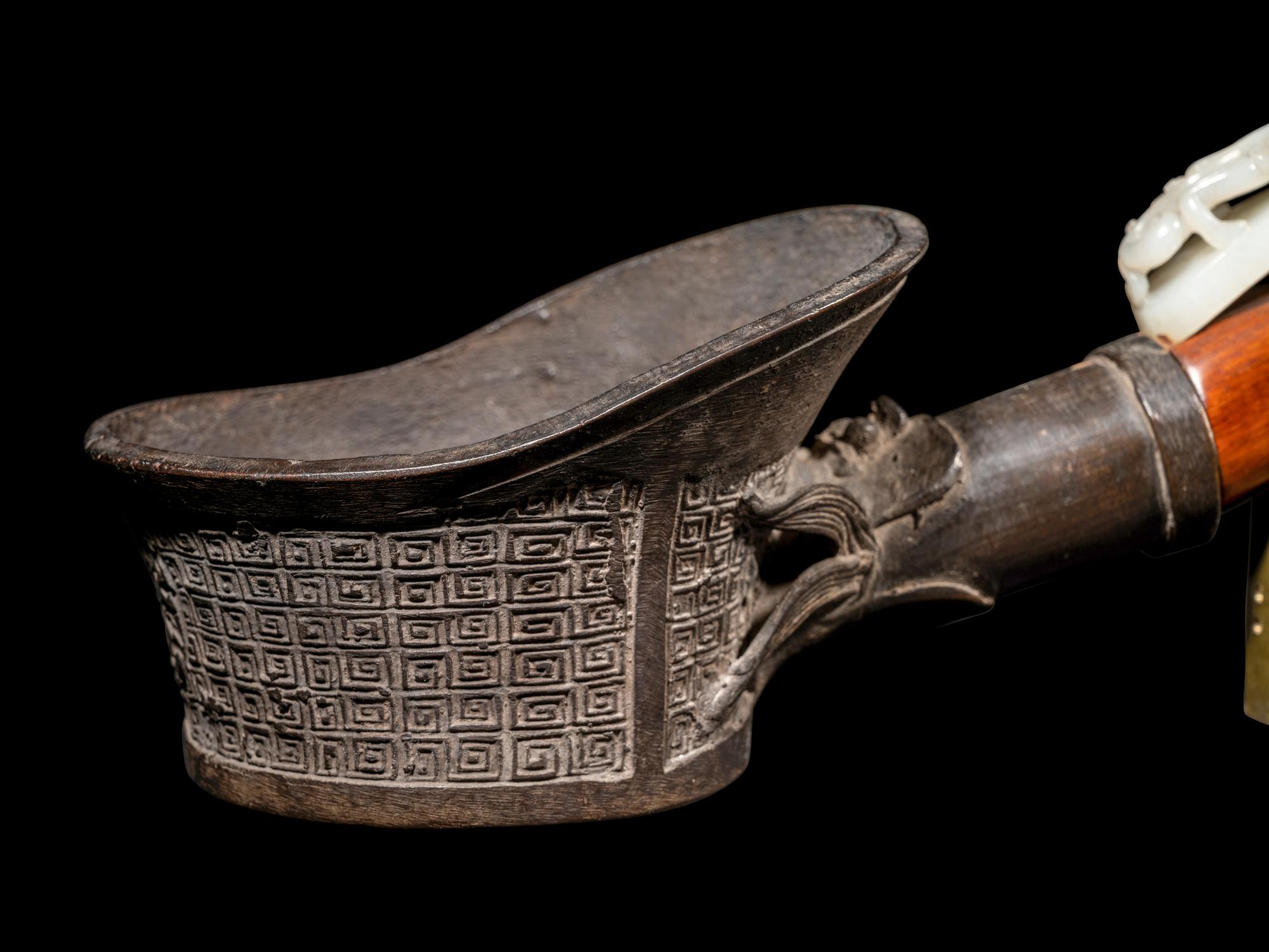 A Chinese White Jade Belt Hook-Mounted Iron