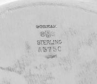 A Set of Twelve American Silver Bread Plates