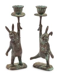 A Pair of Patinated Cast Metal Rabbit Candlesticks