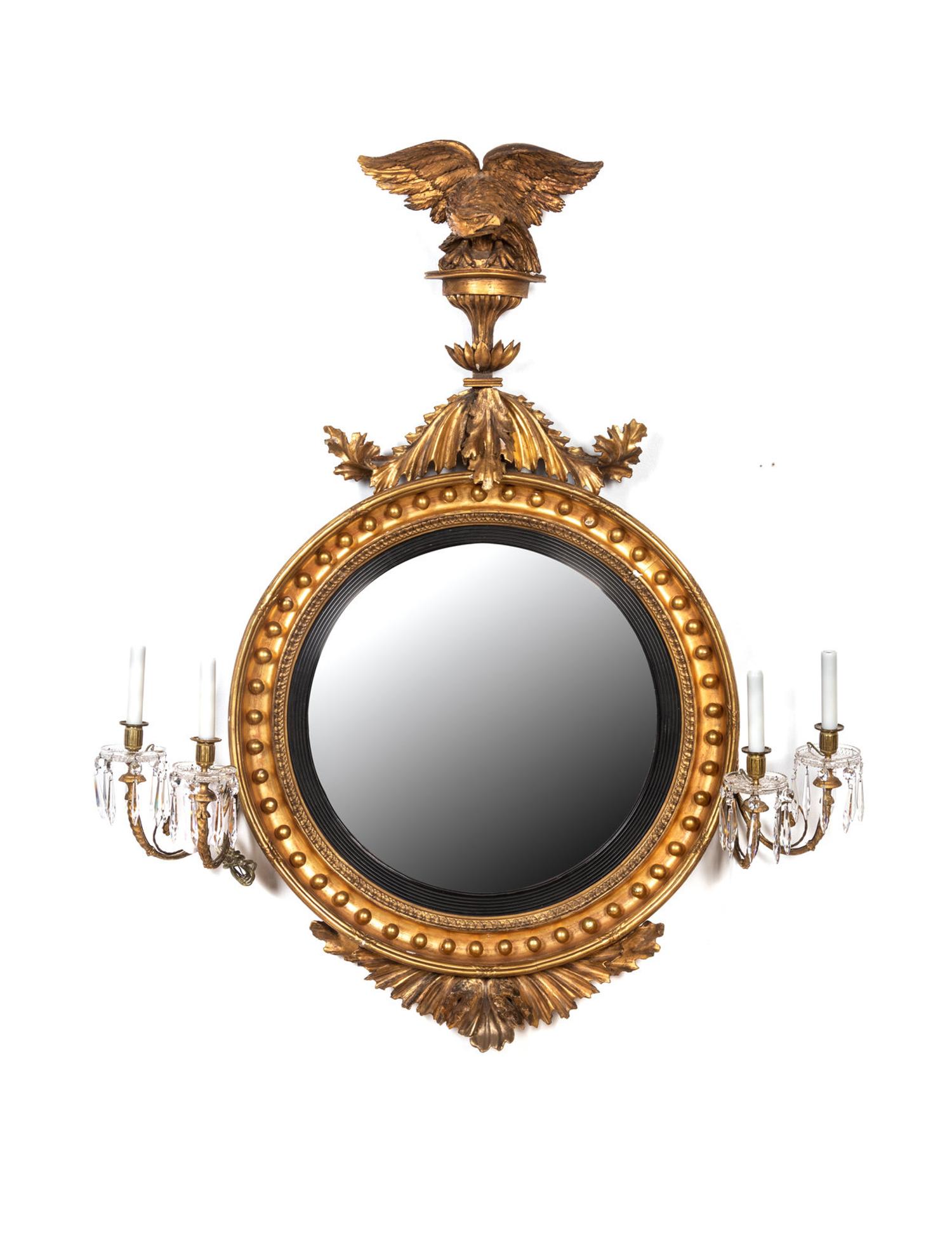 A Regency Carved Giltwood Convex Girandole Mirror by Thomas Fentham