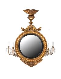 A Regency Carved Giltwood Convex Girandole Mirror by Thomas Fentham