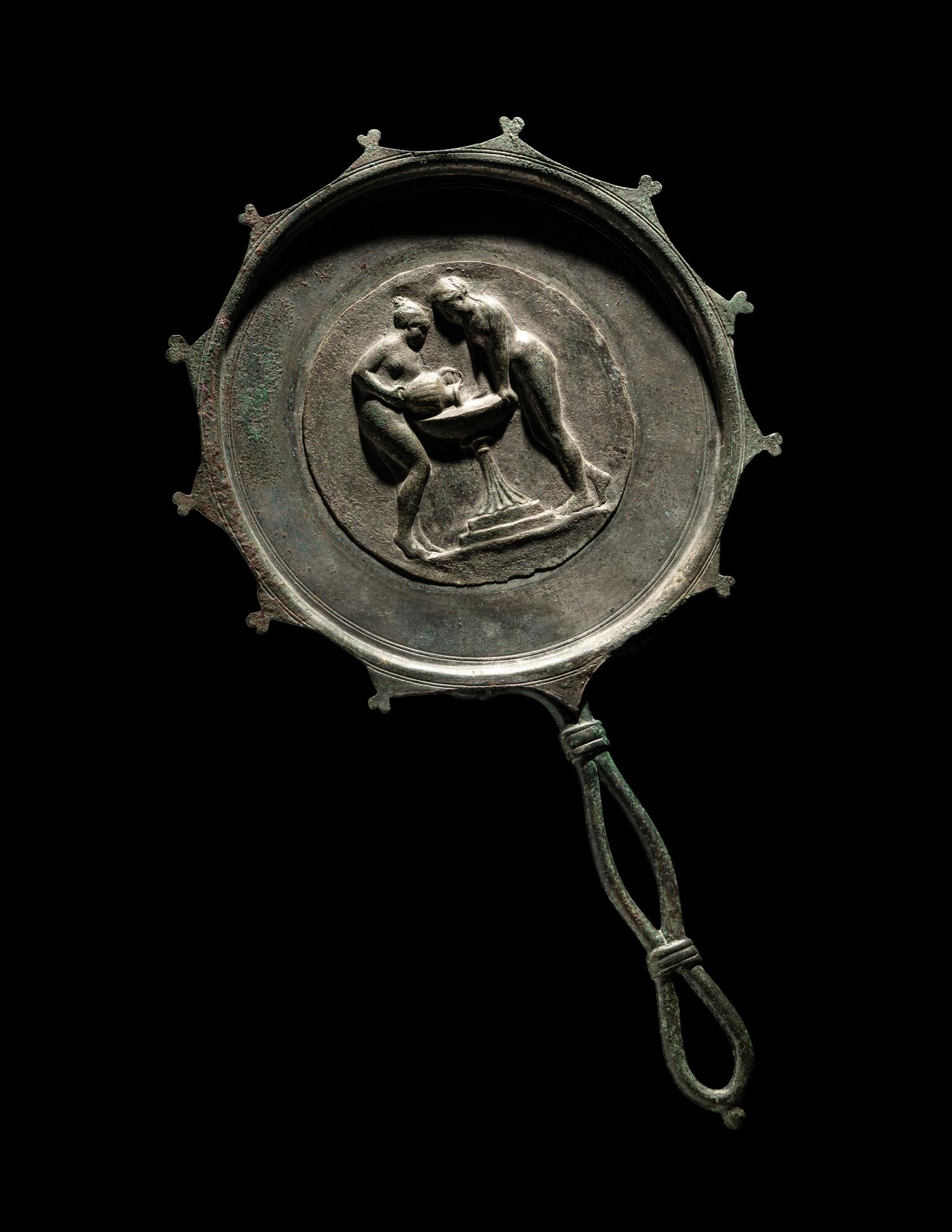 A Roman Bronze and Silver Mirror with Two Women