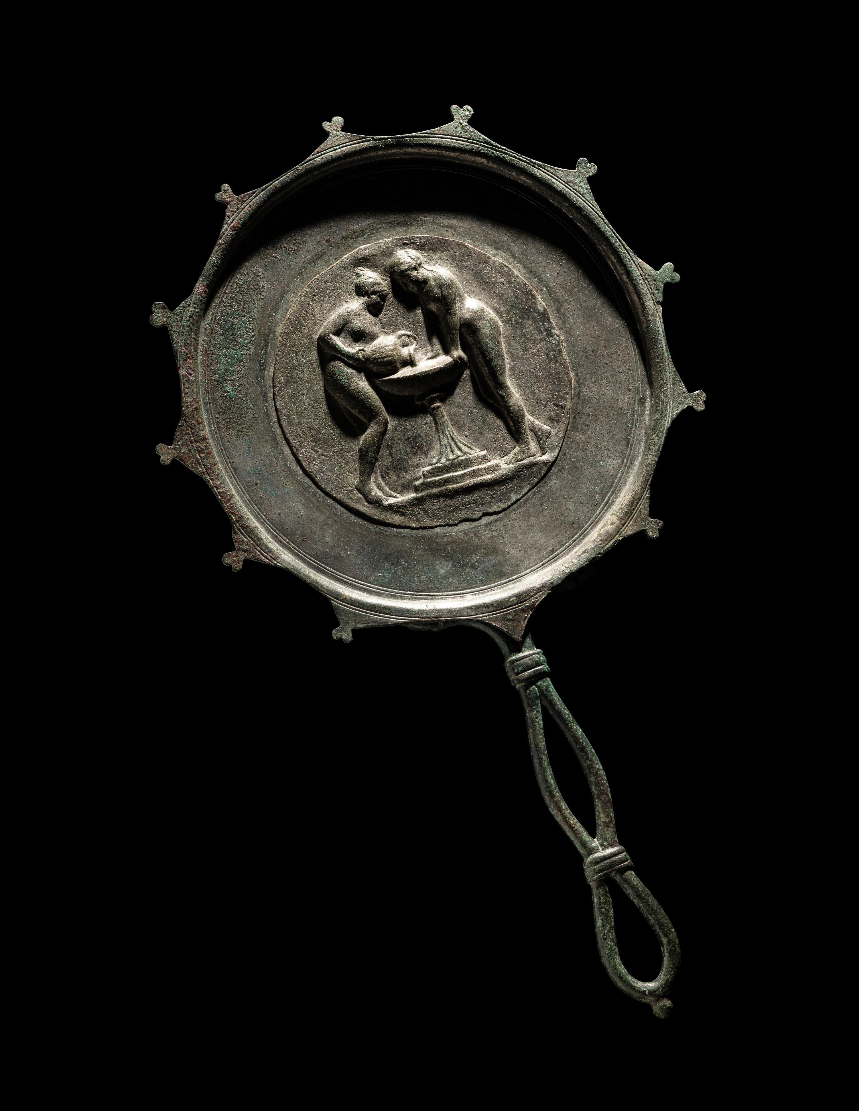A Roman Bronze and Silver Mirror with Two Women