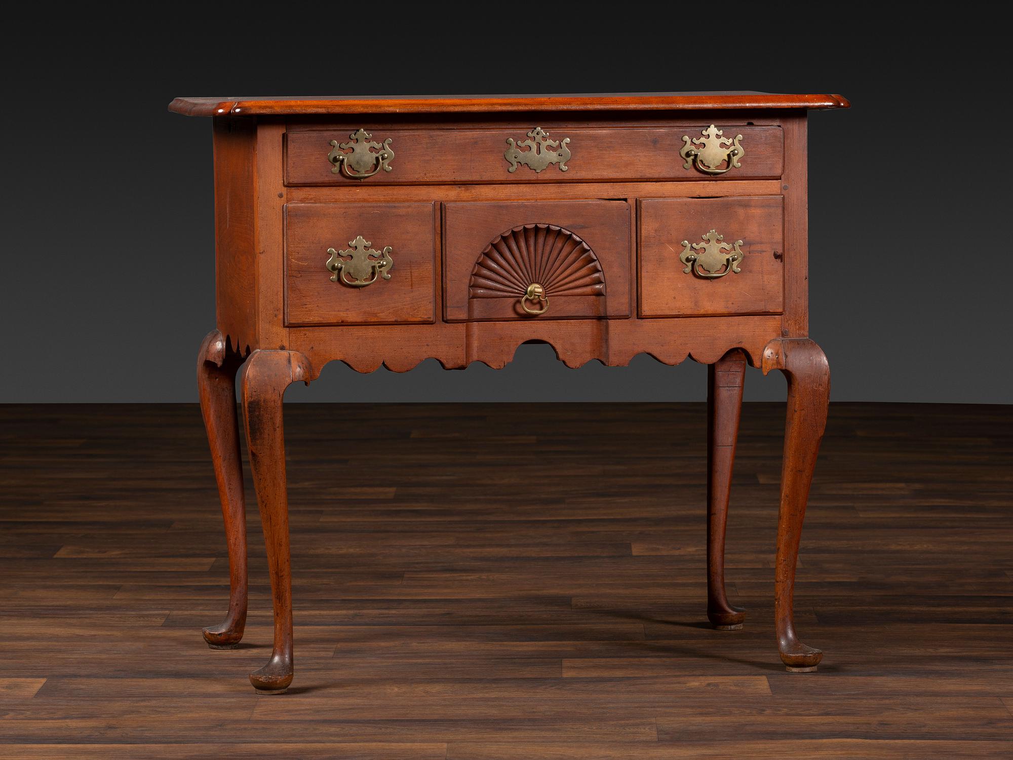 A Queen Anne Cherrywood and Maple Pad Foot Dressing Table