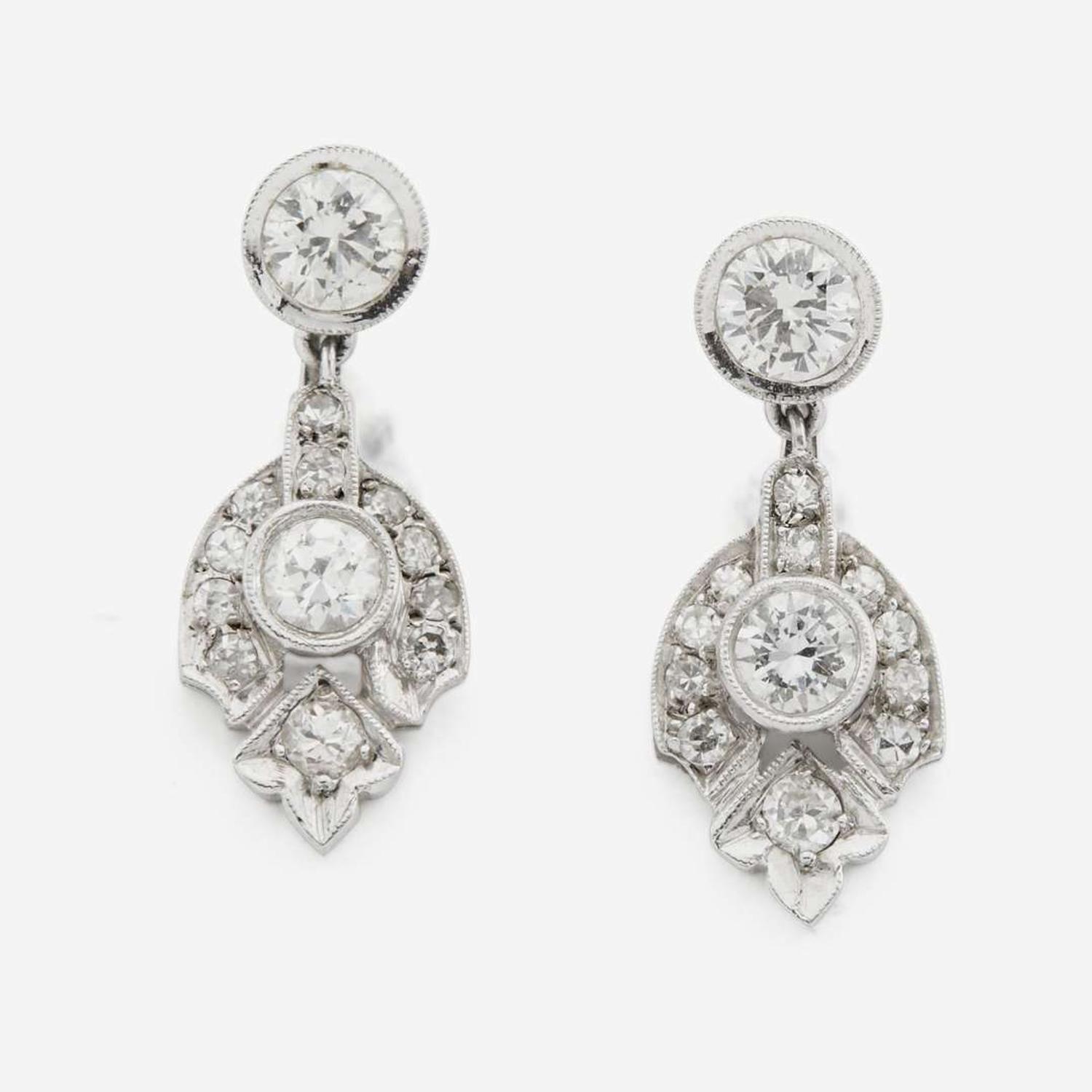 A pair of diamond and white gold earrings