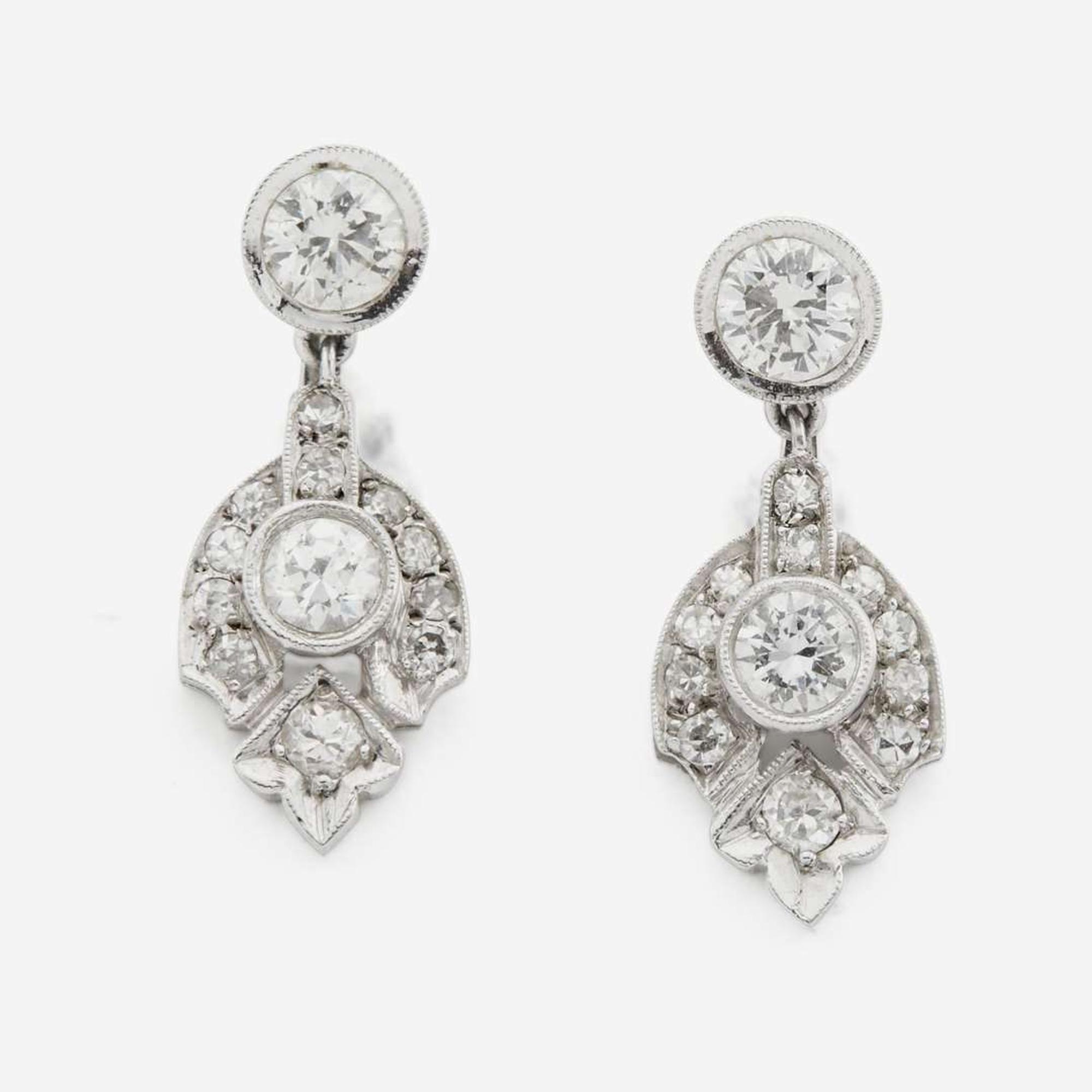 A pair of diamond and white gold earrings