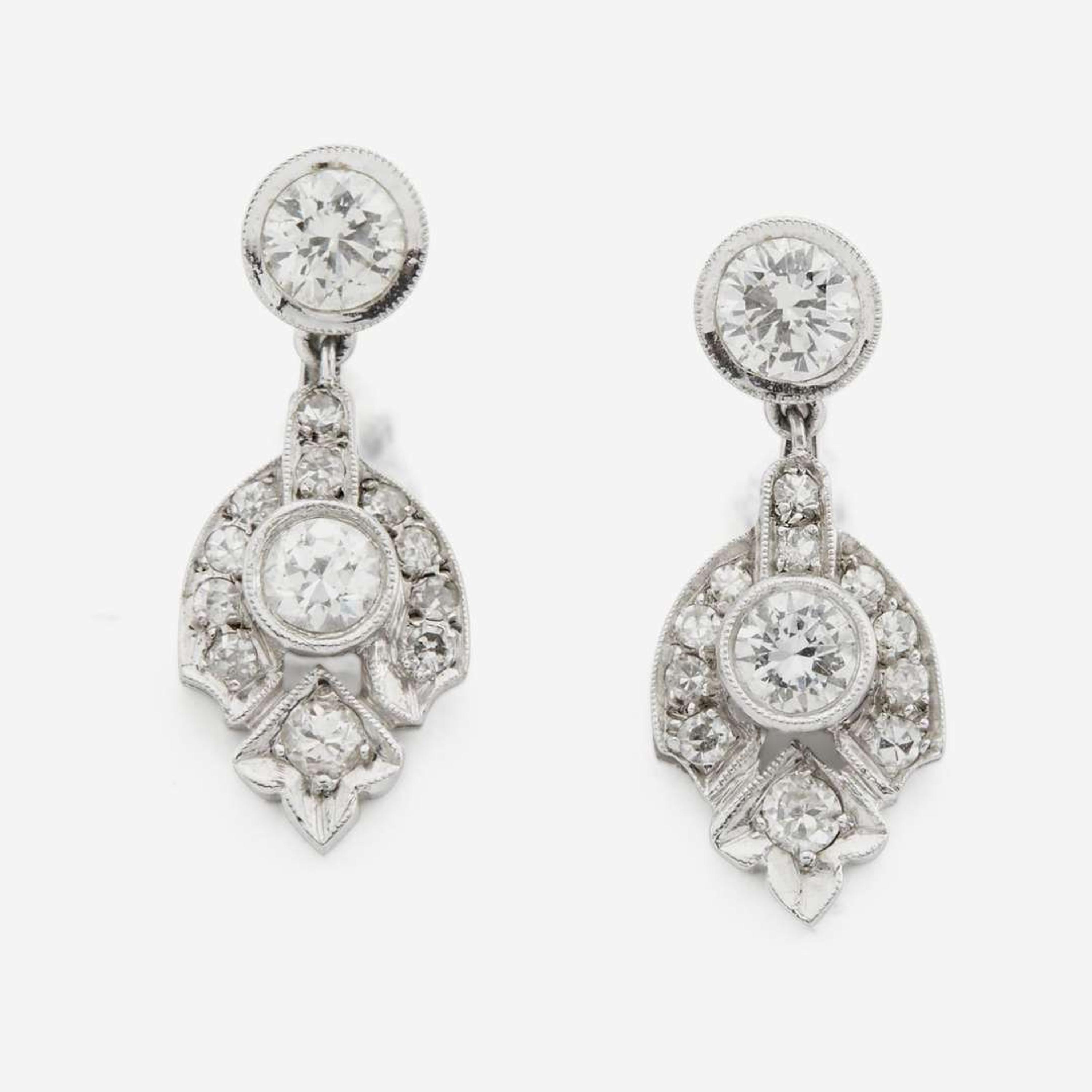 A pair of diamond and white gold earrings