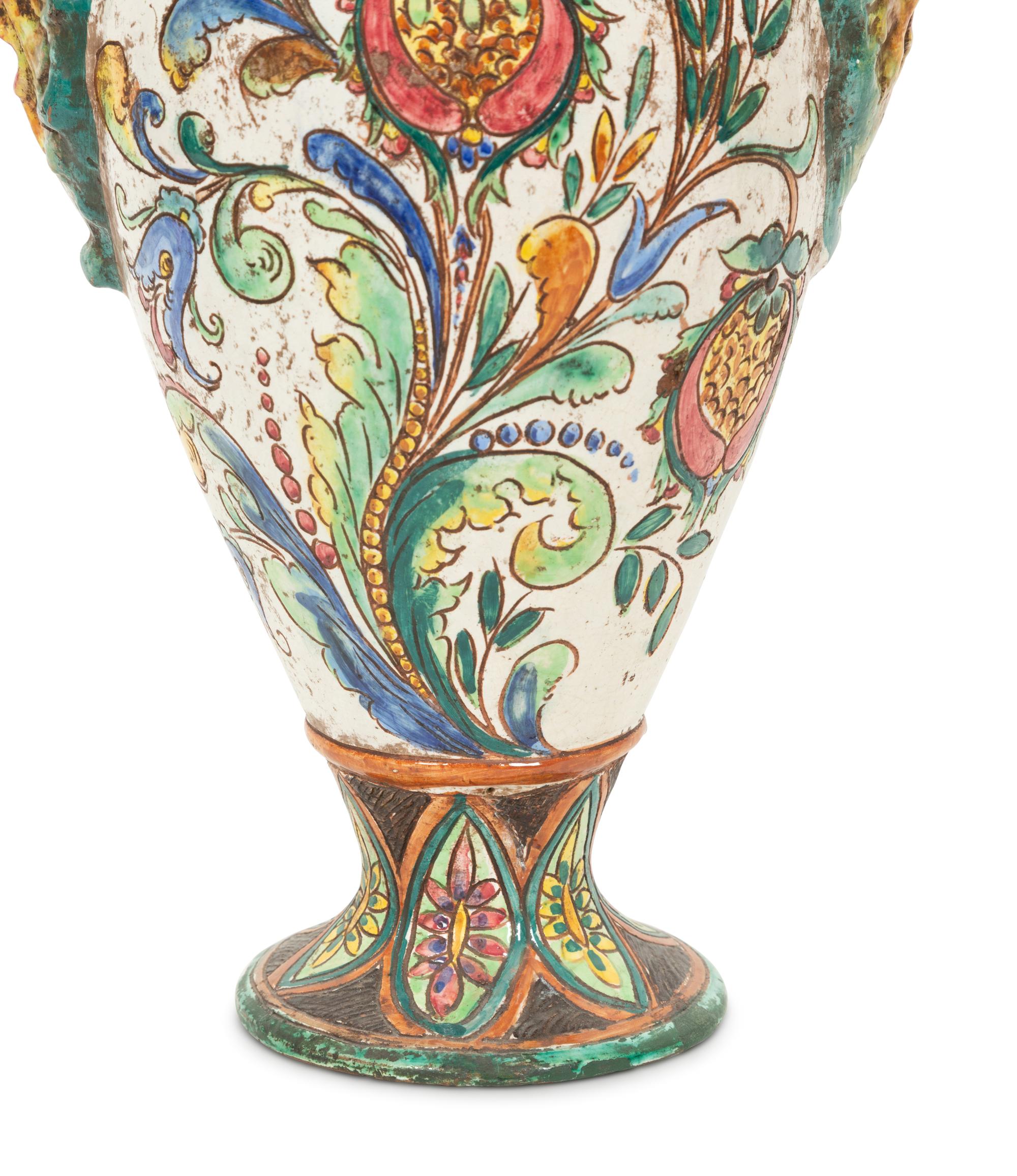 An Italian Majolica Covered Urn with Lion Mask Handles