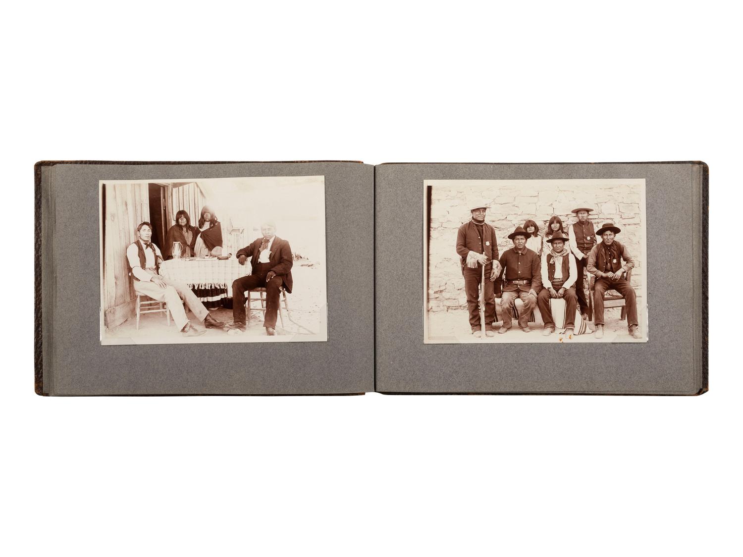 [NATIVE AMERICANS]. JONES, John Edward (1863-1922), photographer. Album containing 50 photographs of the San Carlos Indian Agency, including Apache civilians and police, agency buildings and dwellings, and scenic views. Ca 1904.
