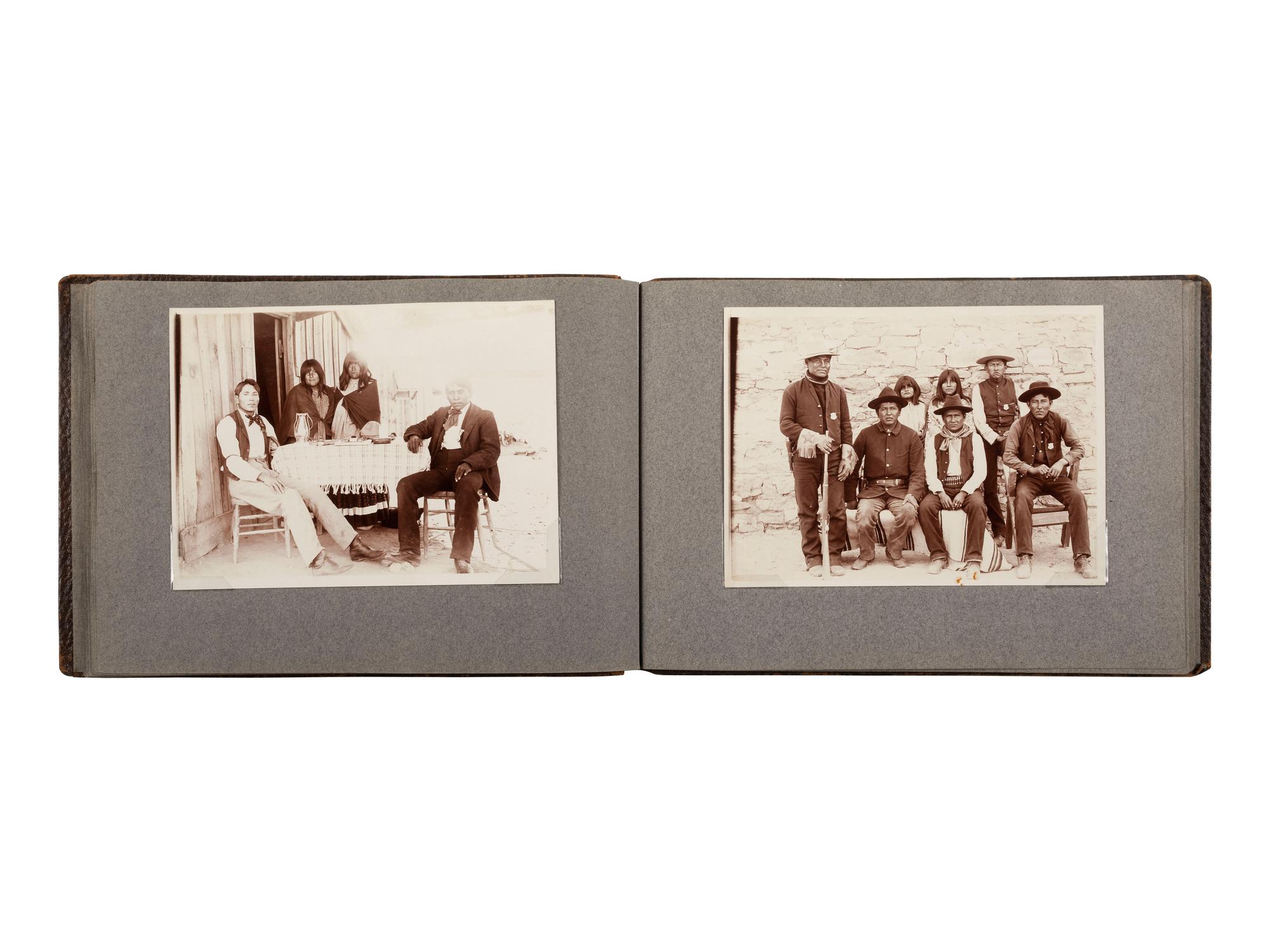 [NATIVE AMERICANS]. JONES, John Edward (1863-1922), photographer. Album containing 50 photographs of the San Carlos Indian Agency, including Apache civilians and police, agency buildings and dwellings, and scenic views. Ca 1904.