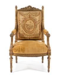 A Louis XVI Style Giltwood Fauteuil Height 42 inches. — 19TH CENTURY