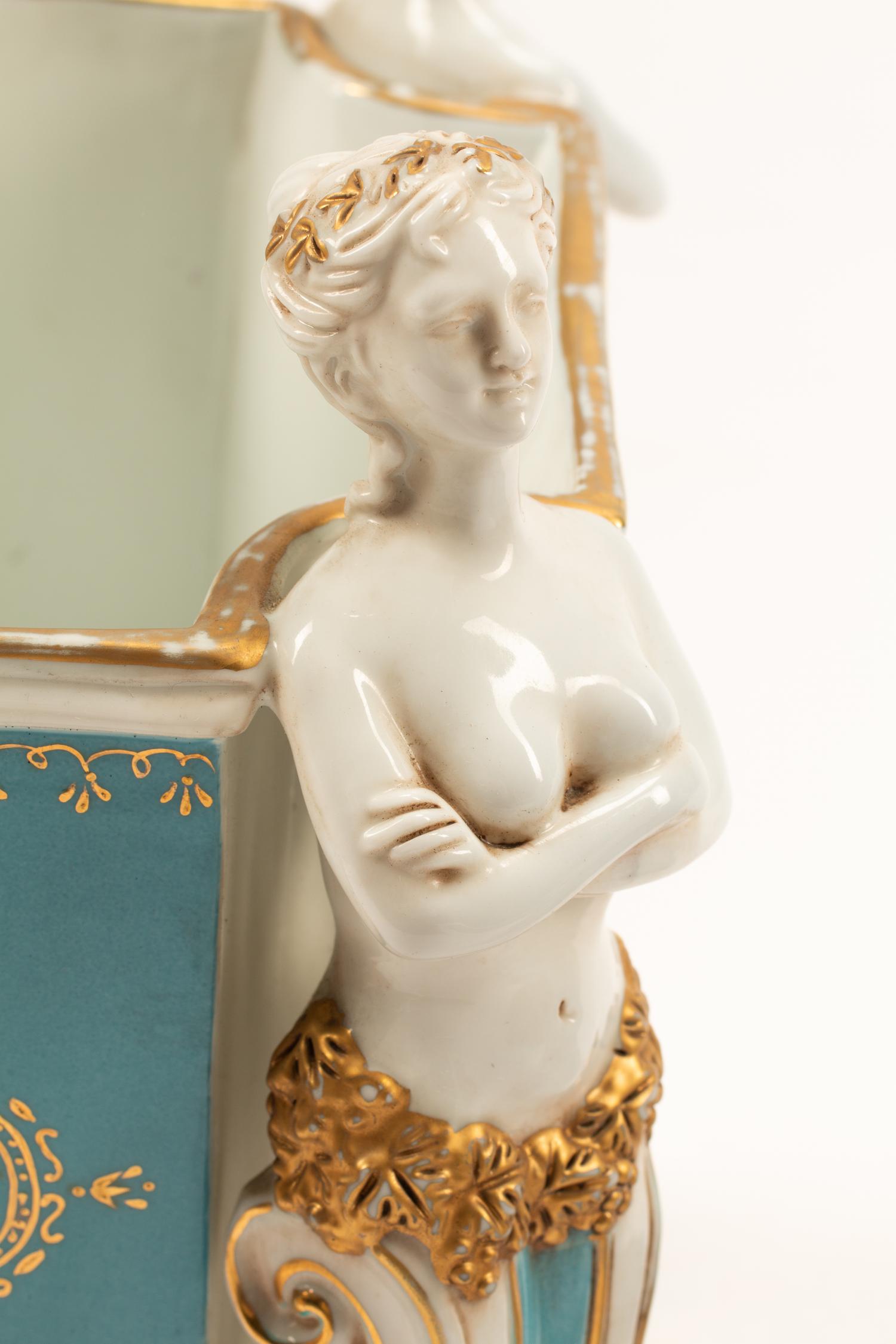 A Pair of Sevres Style Porcelain Cache Pots