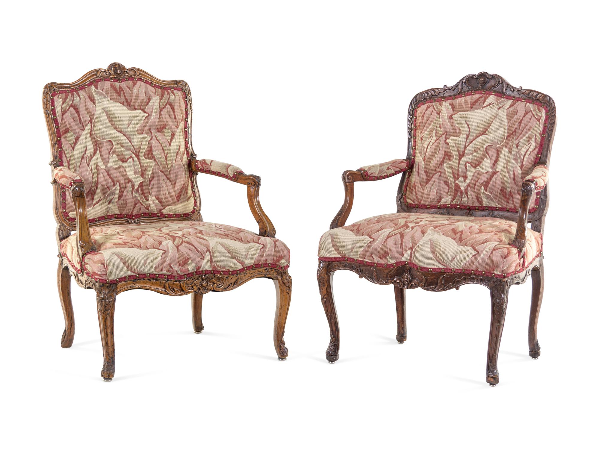 A Pair of Louis XV Walnut Fauteuils