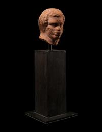 A Nubian Terracotta Head and Reclining Figure